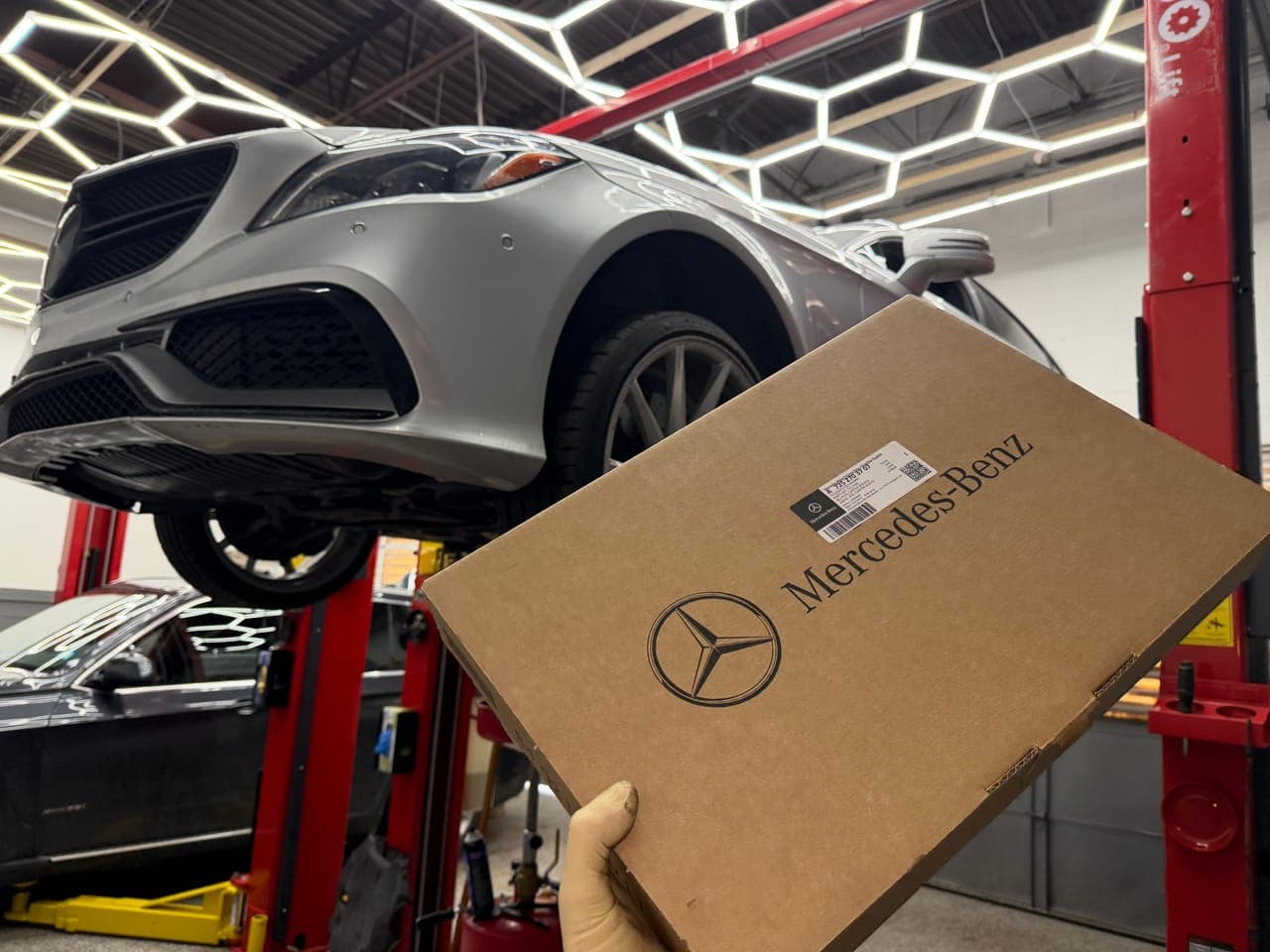 Mercedes-Benz on the lift during diagnostics.