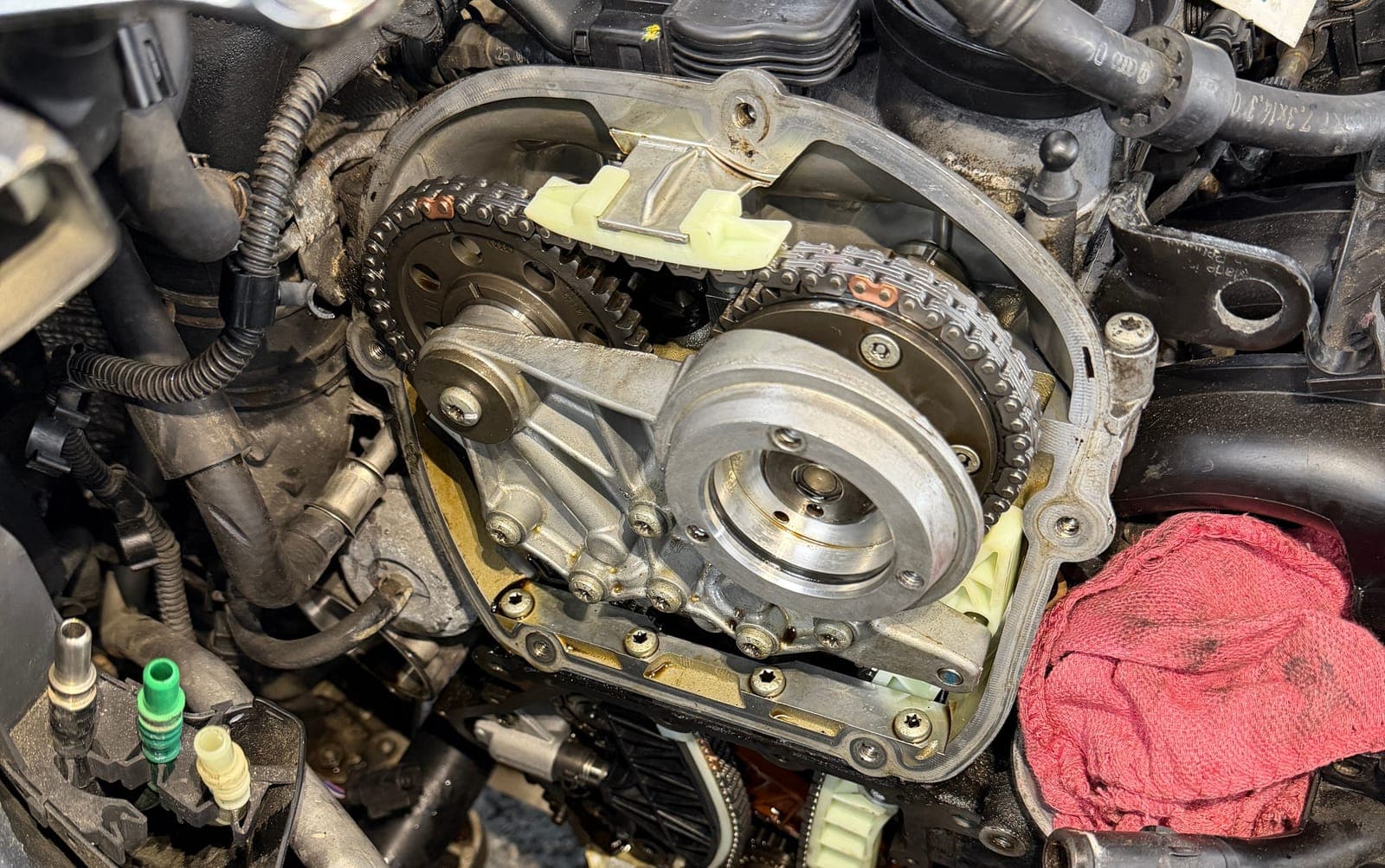 Timing chain, guides and cam adjuster exposed on a Volkswagen 2.0T EA888 engine during a timing chain repair at Pro Tech Auto.